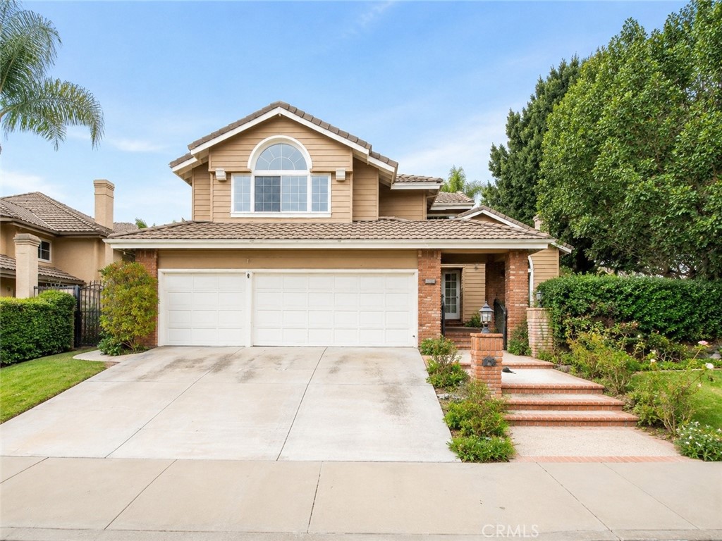 2811 North Roxbury Street Orange, CA 92867 - Photo 1 of 8 a front view of a house with a yard