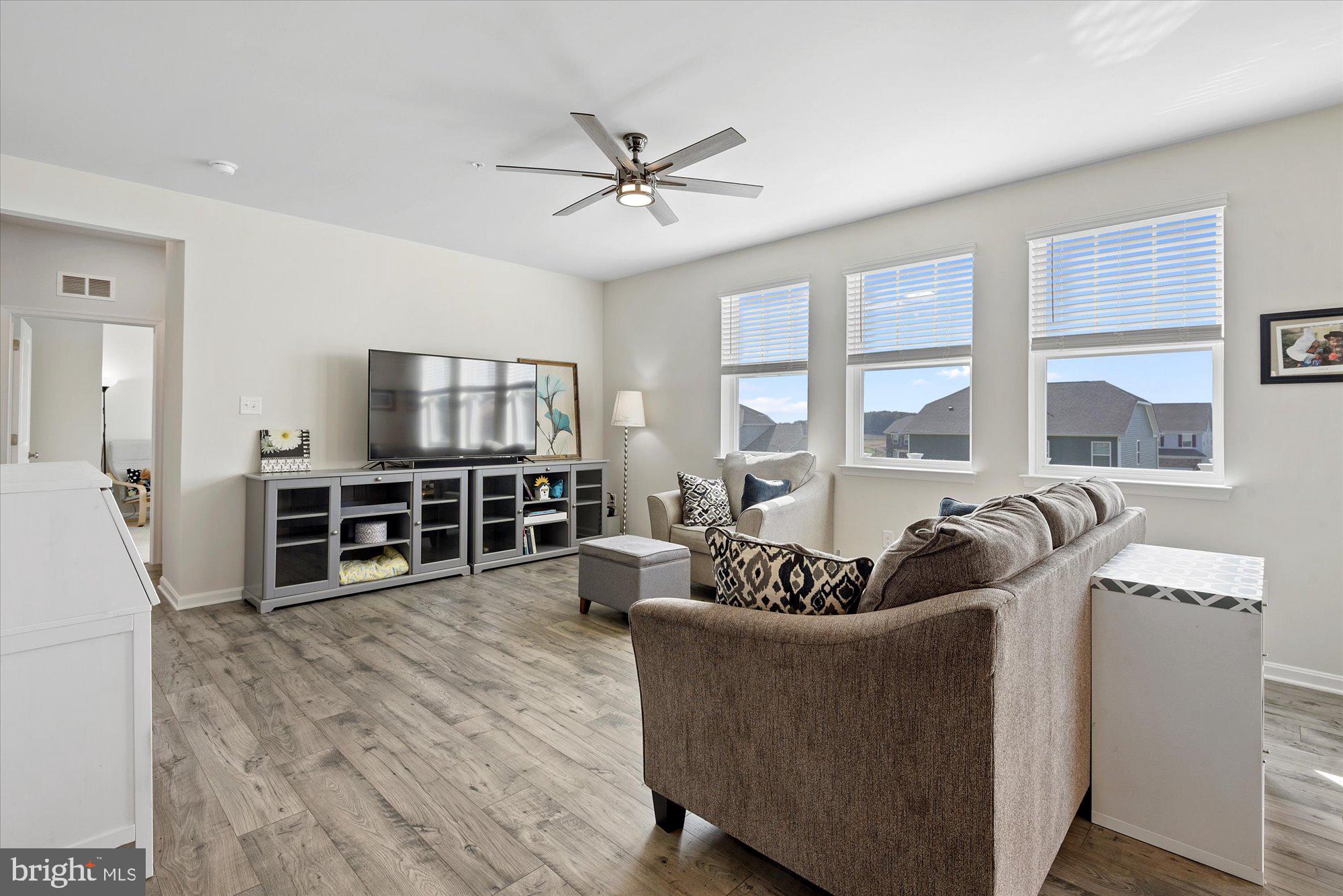 691 Stonegate Road Westminster, MD 21157 - Photo 14 of 36 Main level family room with great light and views