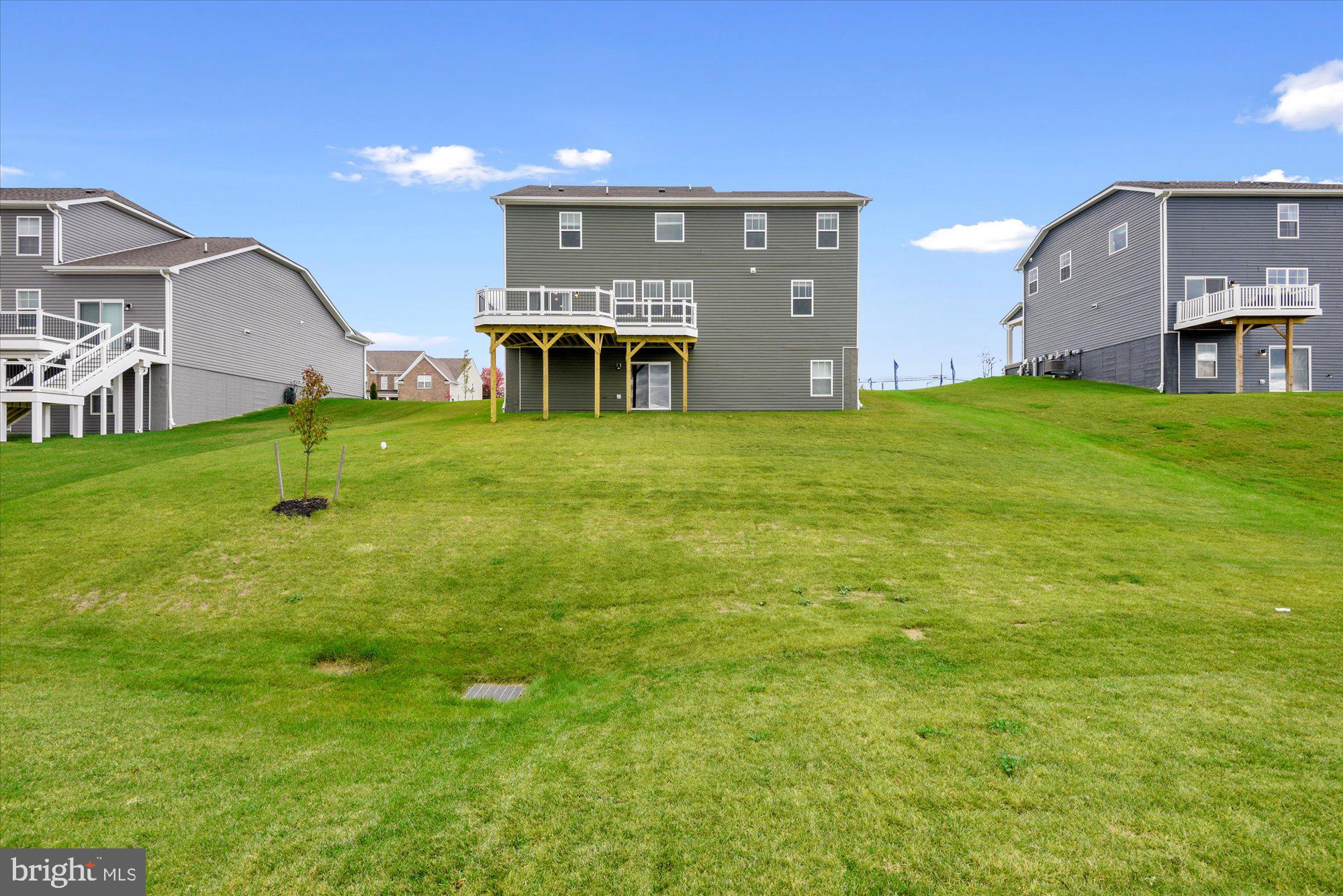 691 Stonegate Road Westminster, MD 21157 - Photo 36 of 36 The rear view showing deck and walkout basement.