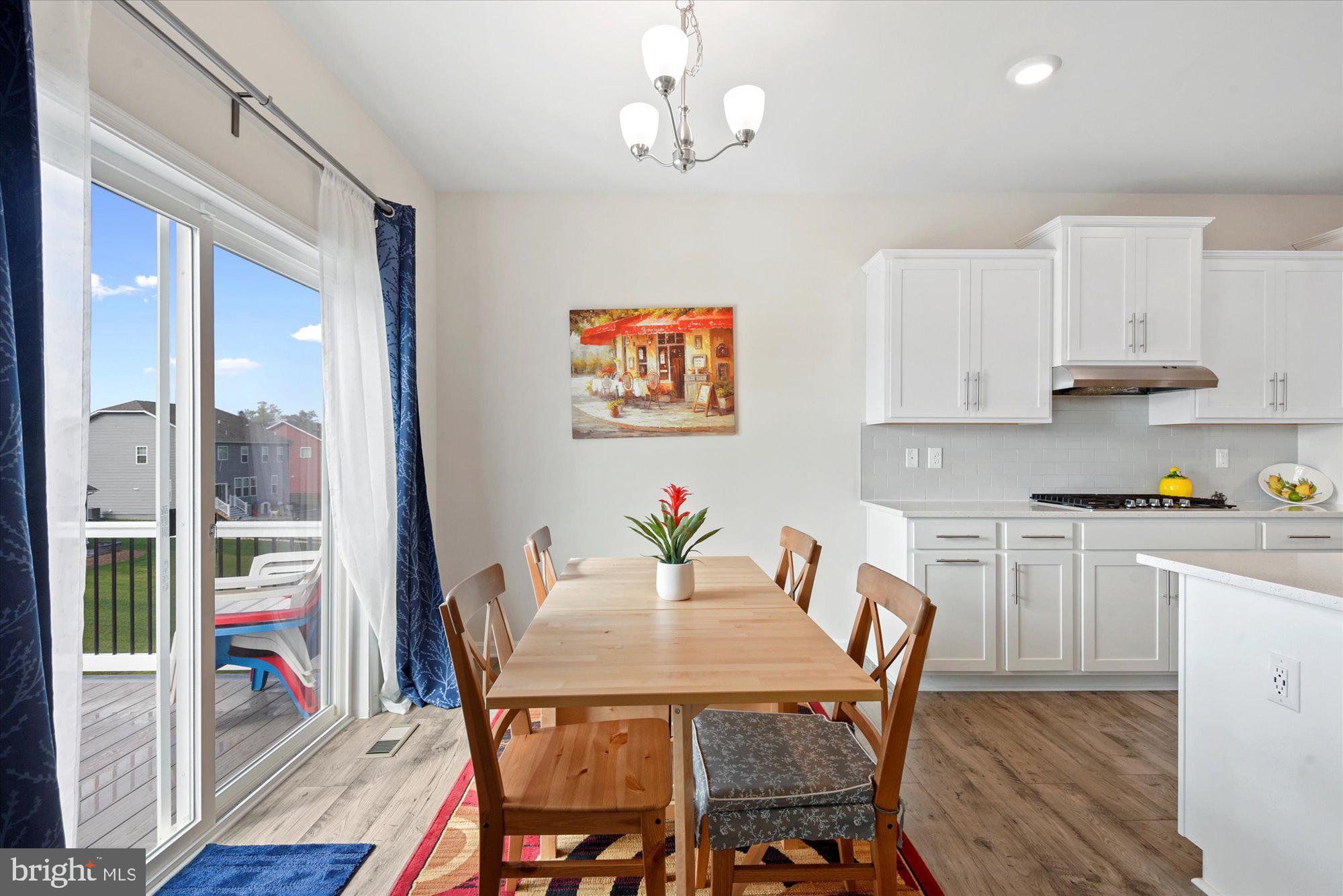 691 Stonegate Road Westminster, MD 21157 - Photo 8 of 36 Eat-in kitchen with access to new composite deck.