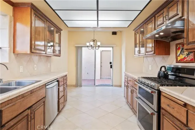 a kitchen that has a lot of cabinets in it