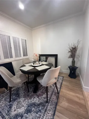 a living room with furniture a rug and a table