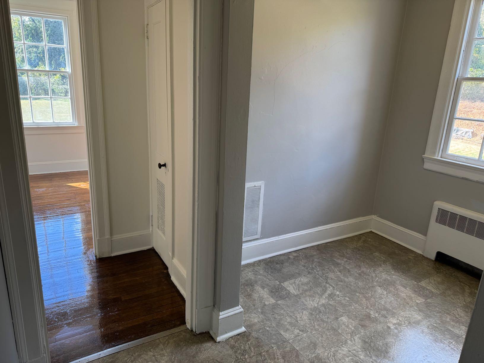 712 Edwin Court, Unit 4 Danville, VA 24541 - Photo 4 of 8 a view of hallway with window and wooden floor