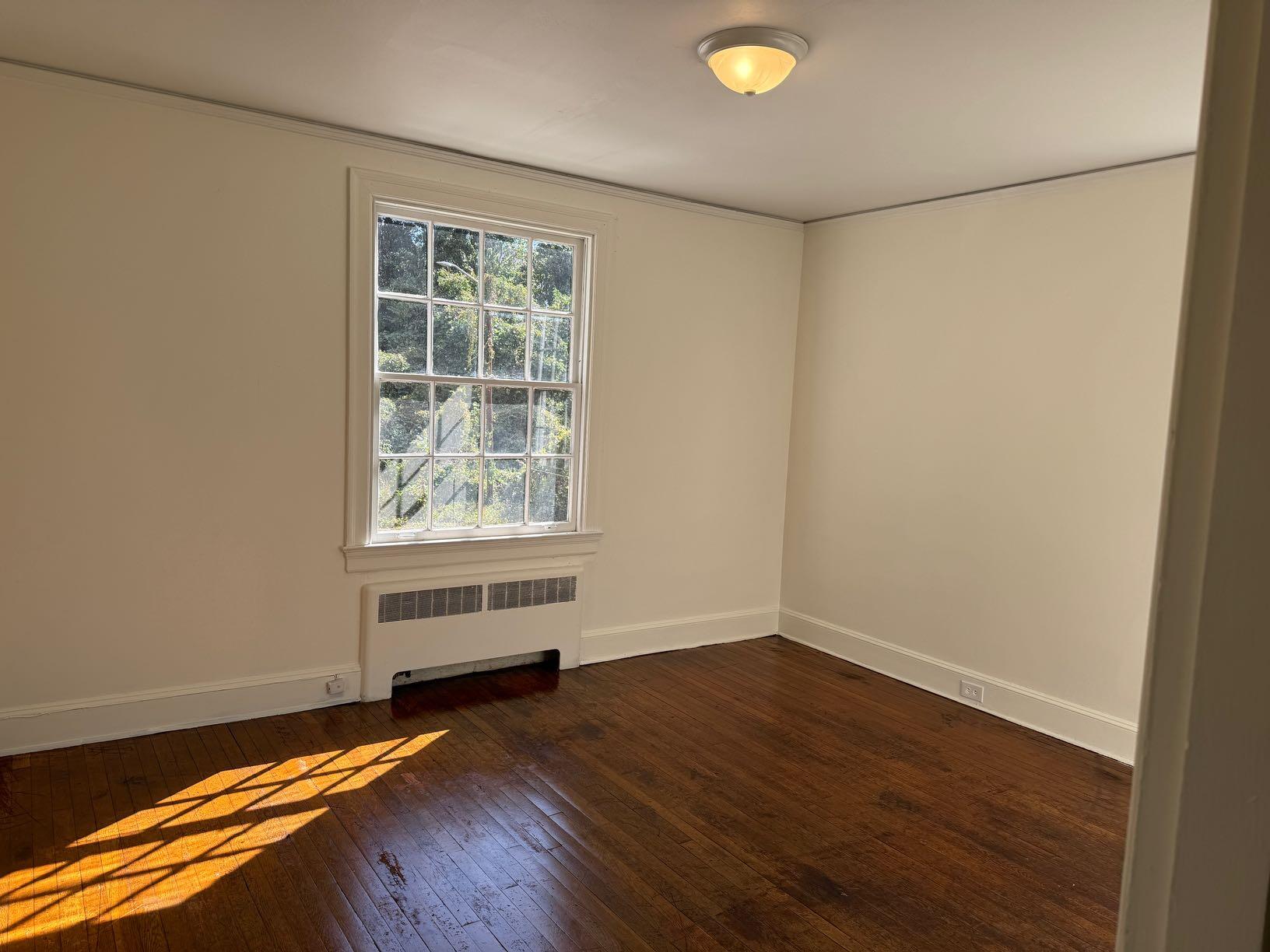 712 Edwin Court, Unit 4 Danville, VA 24541 - Photo 5 of 8 a view of room with window and wooden floor