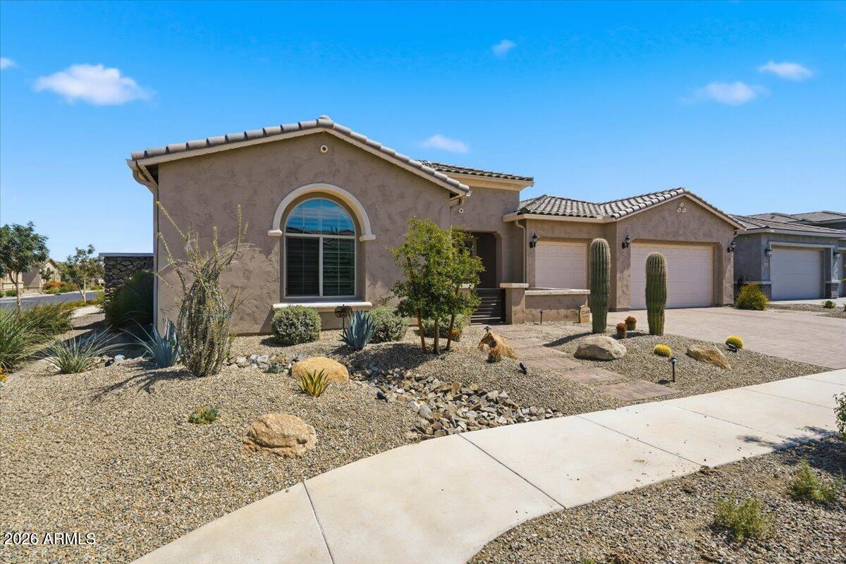 22608 East Stacey Road Queen Creek, AZ 85142 - Photo 45 of 83 a front view of a house with trees in the background