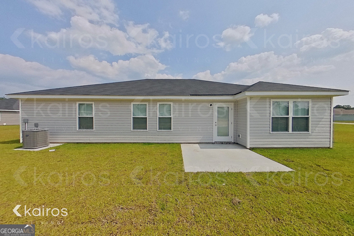 205 Redwood Court Springfield, GA 31329 - Photo 11 of 13 a view of a house with a swimming pool