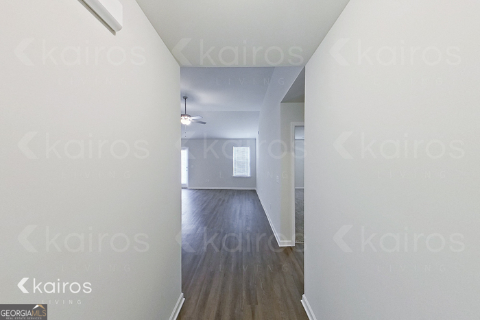 205 Redwood Court Springfield, GA 31329 - Photo 2 of 13 a view of a hallway with wooden floor
