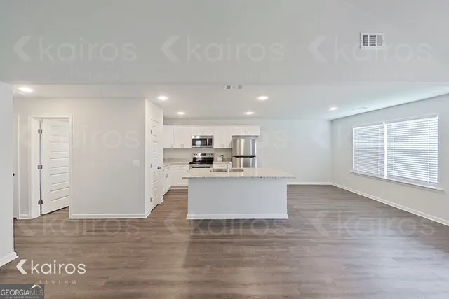 a view of kitchen with wooden floor
