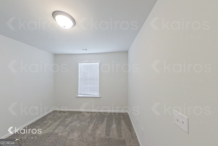 205 Redwood Court Springfield, GA 31329 - Photo 9 of 13 an empty room with a window