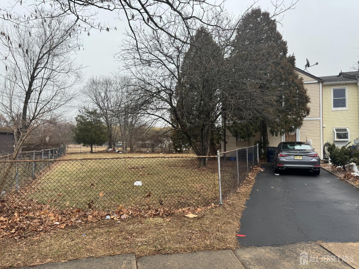 97 Redbud Road Piscataway, NJ 08854 - Photo 1 of 1 a view of a street with a house and trees