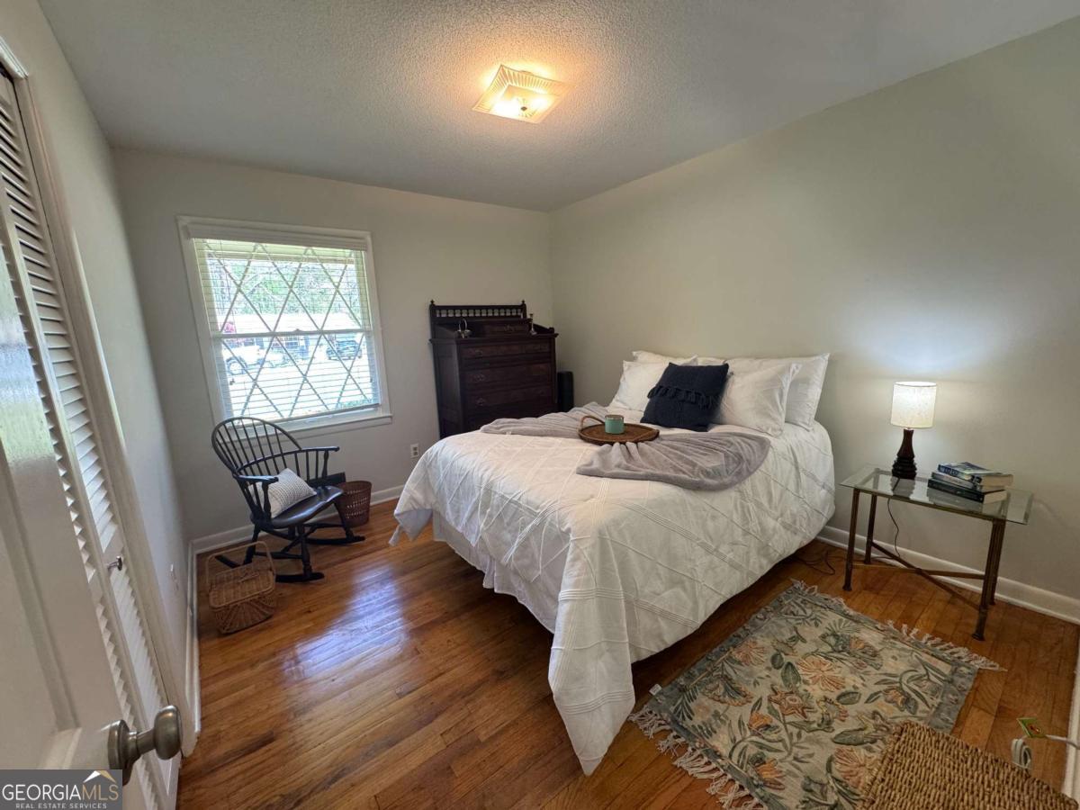 149 Caroline Avenue Athens, GA 30606 - Photo 12 of 42 a bedroom with a bed and chair