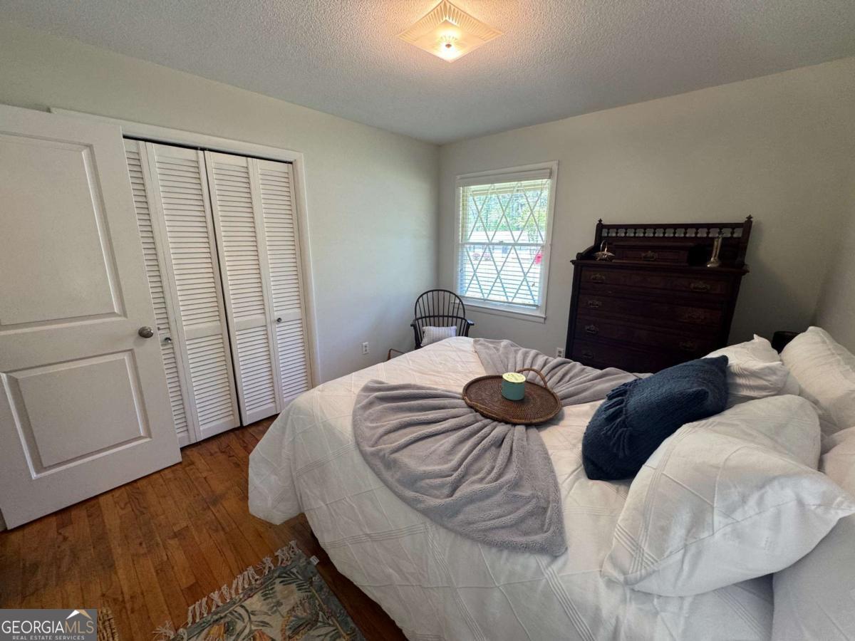 149 Caroline Avenue Athens, GA 30606 - Photo 13 of 42 a bedroom with a bed and window