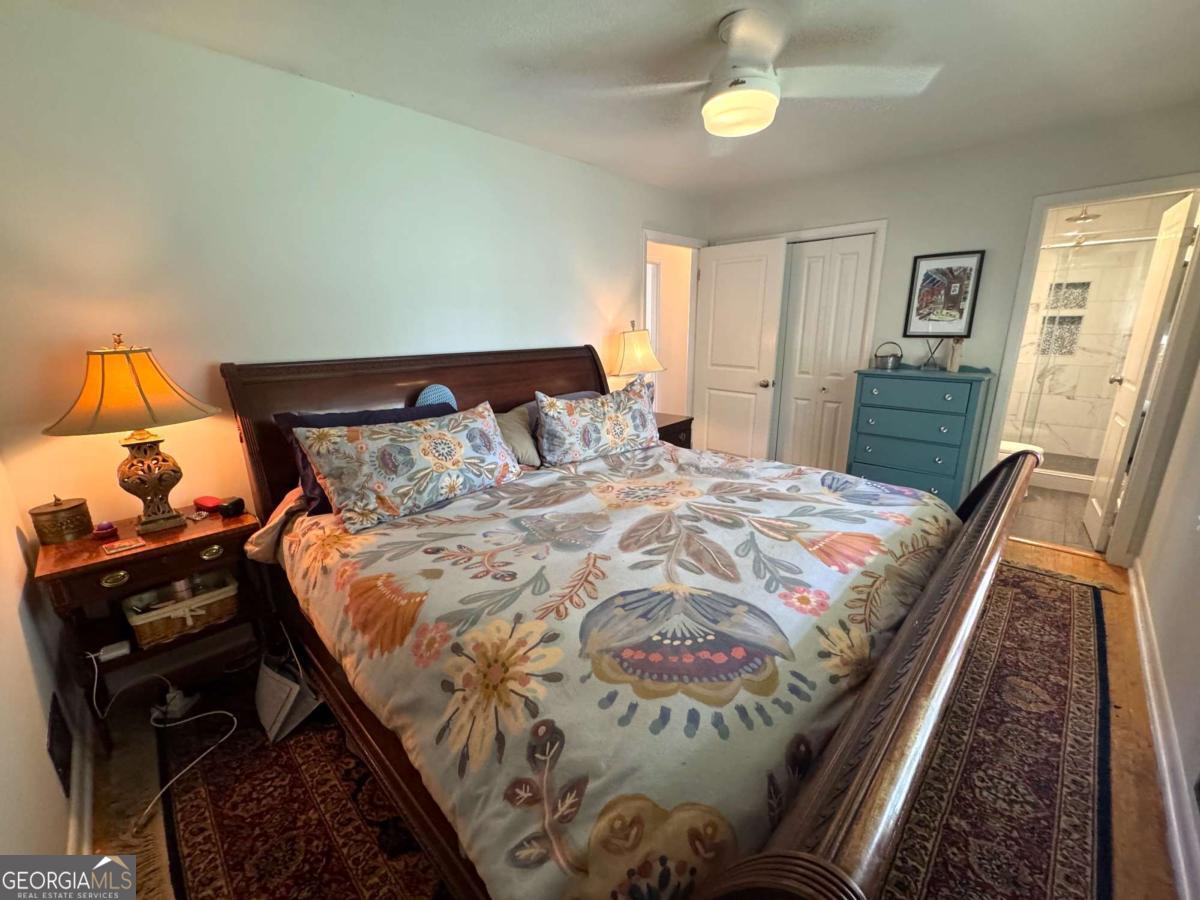 149 Caroline Avenue Athens, GA 30606 - Photo 23 of 42 a bed sitting in a bedroom next to a window