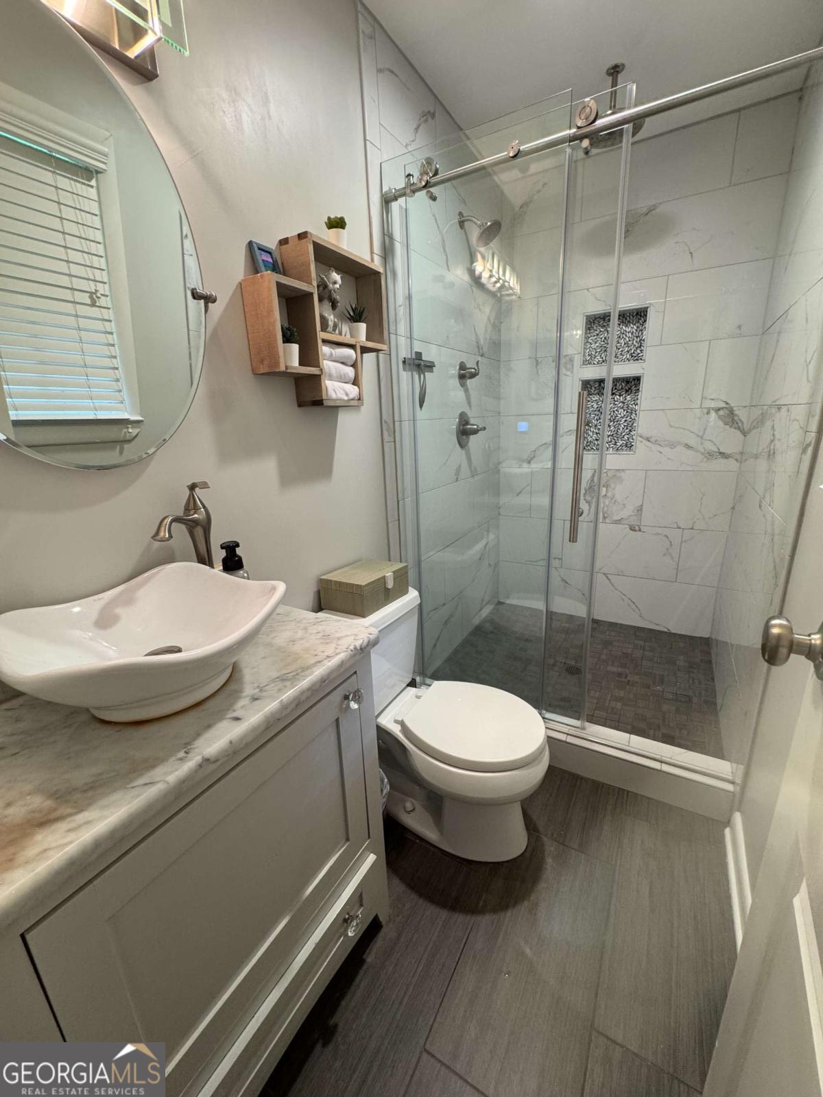 149 Caroline Avenue Athens, GA 30606 - Photo 25 of 42 a bathroom with a sink toilet and shower