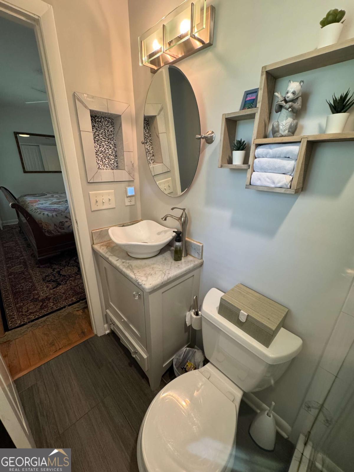149 Caroline Avenue Athens, GA 30606 - Photo 26 of 42 a bathroom with a toilet sink and mirror