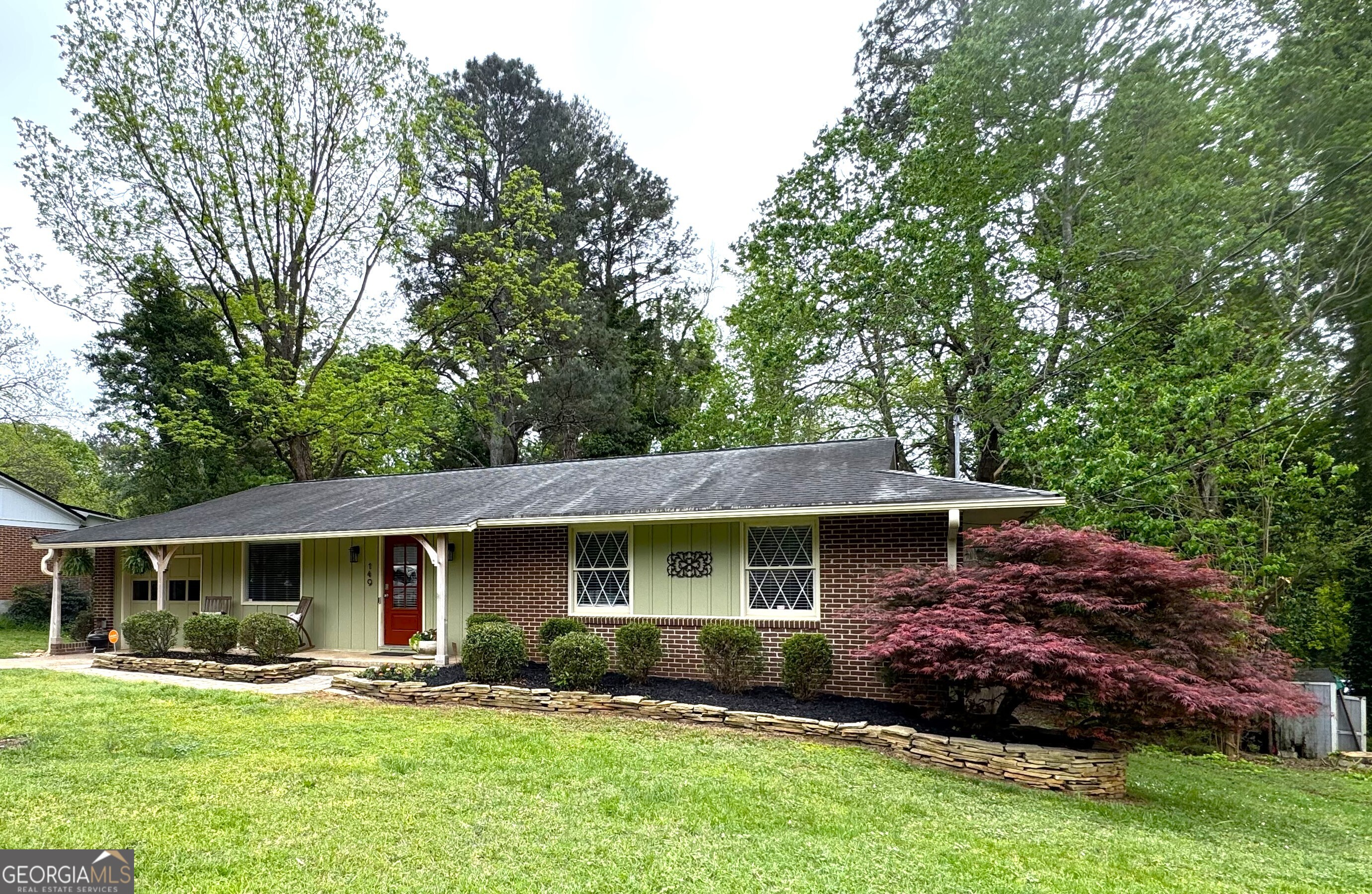 149 Caroline Avenue Athens, GA 30606 - Photo 42 of 42 a front view of a house with a garden and trees