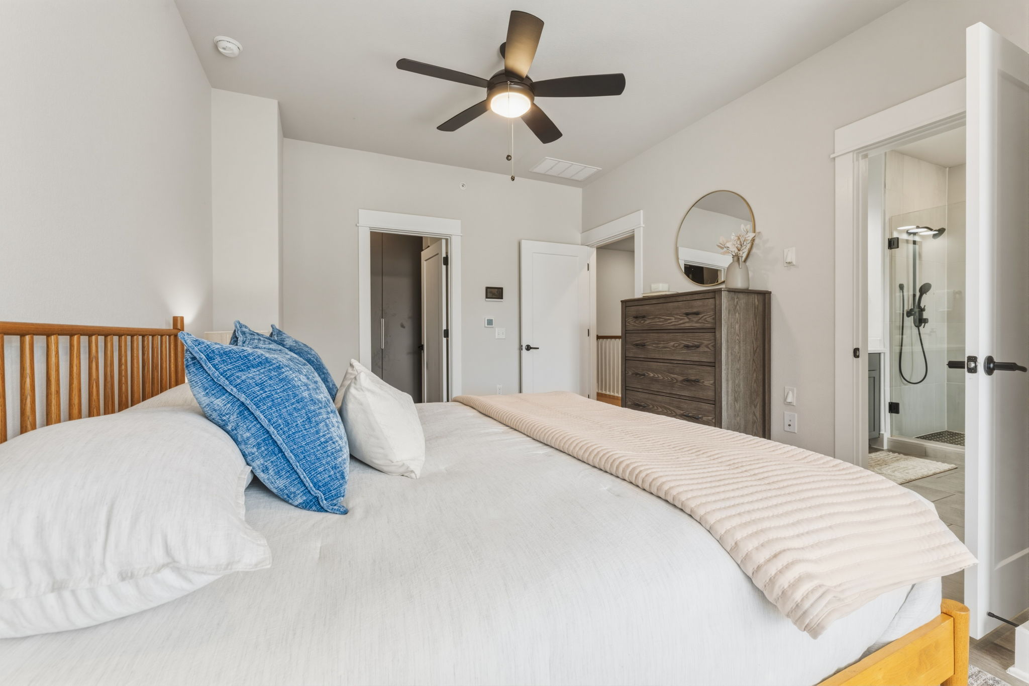 2929 Moreno Street Austin, TX 78723 - Photo 30 of 40 Bedroom with light-toned walls, a ceiling fan, and a wood-slat headboard