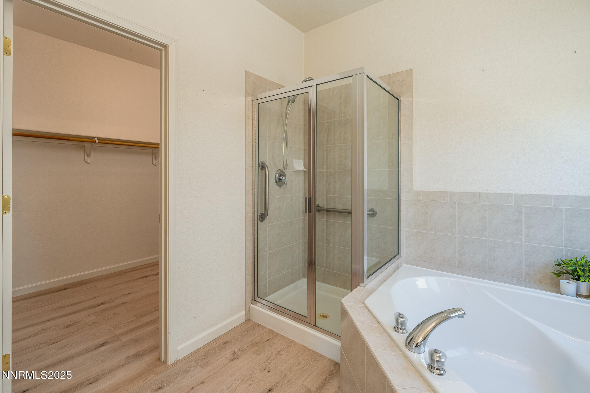 1870 Badlands Drive Reno, NV 89521 - Photo 22 of 31 a bathroom with a tub shower and sink