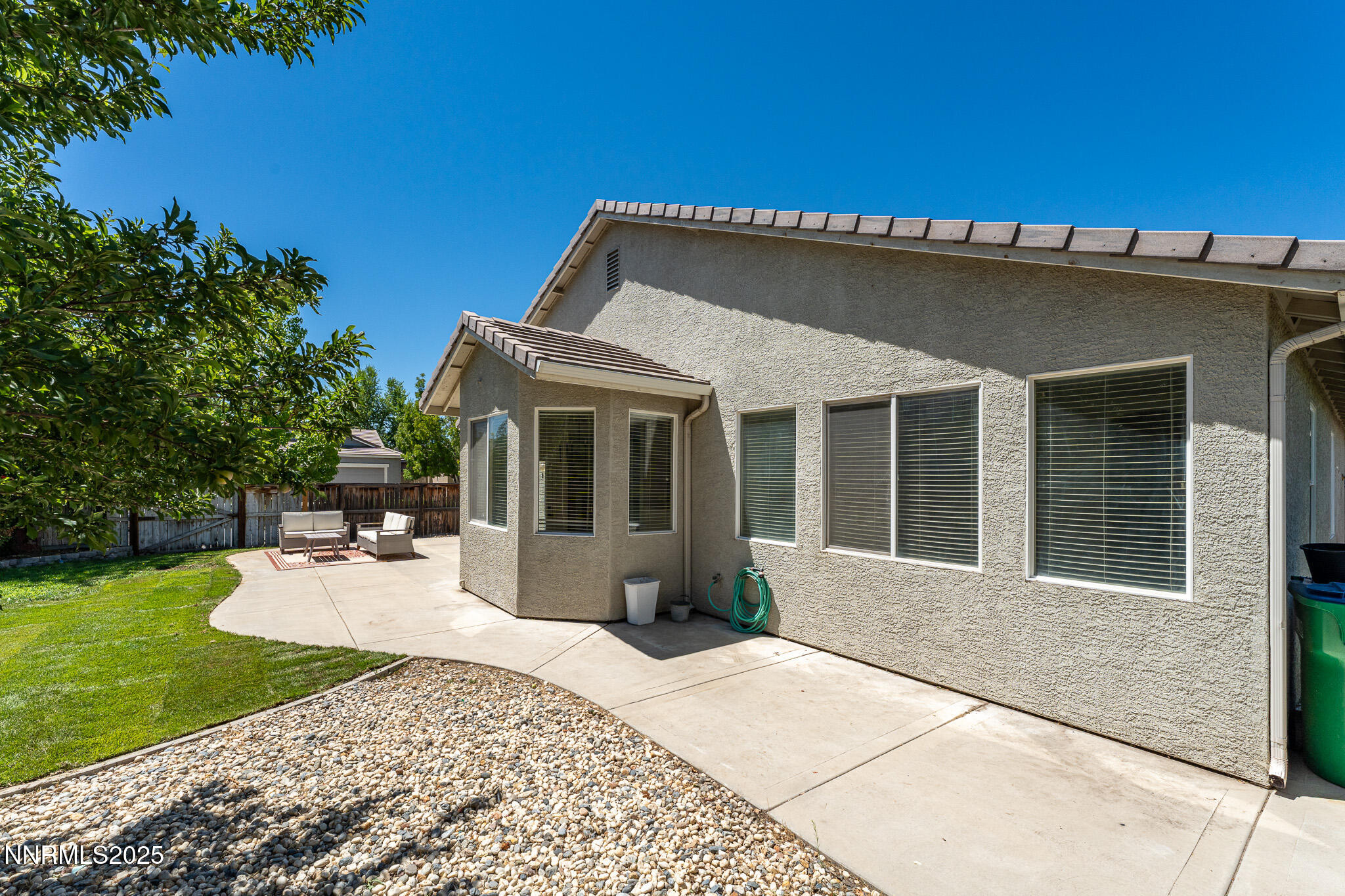 1870 Badlands Drive Reno, NV 89521 - Photo 27 of 31 a front view of a house with a garden and patio