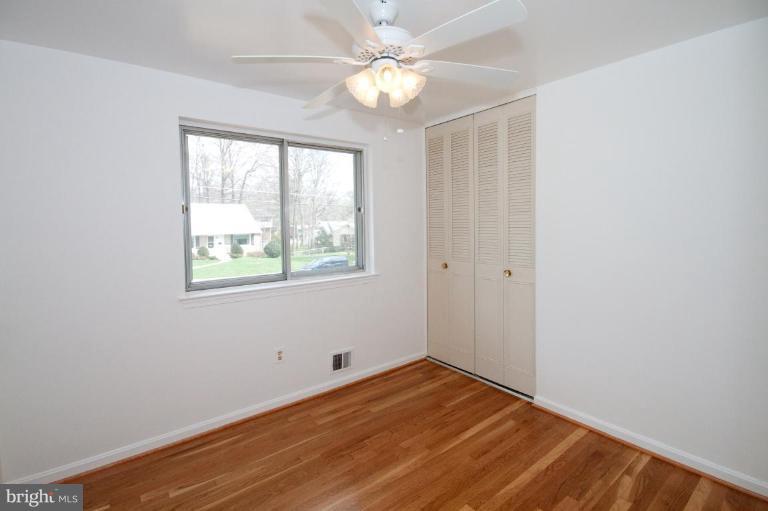 5510 Callander Drive Springfield, VA 22151 - Photo 11 of 17 wooden floor in an empty room with a window