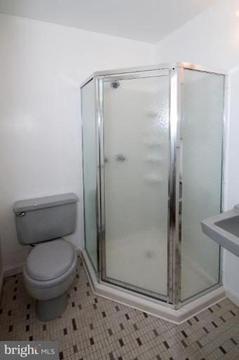 5510 Callander Drive Springfield, VA 22151 - Photo 12 of 17 a bathroom with a toilet and a shower