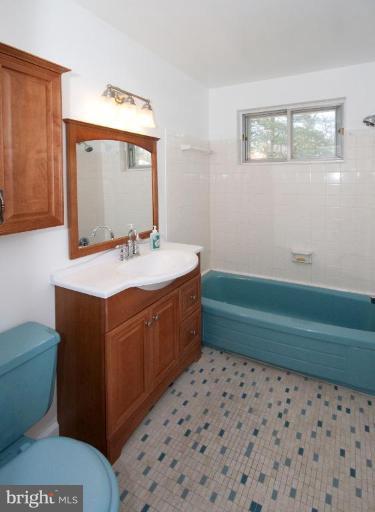 5510 Callander Drive Springfield, VA 22151 - Photo 13 of 17 a bathroom with a sink mirror vanity and toilet