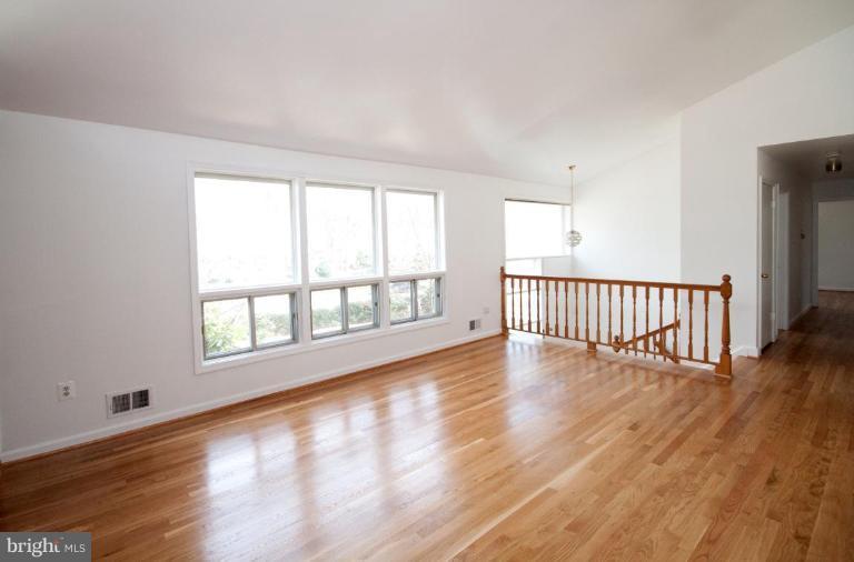 5510 Callander Drive Springfield, VA 22151 - Photo 3 of 17 wooden floor in an empty room with a window