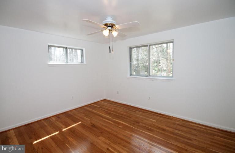 5510 Callander Drive Springfield, VA 22151 - Photo 9 of 17 a view of an empty room with wooden floor and a window