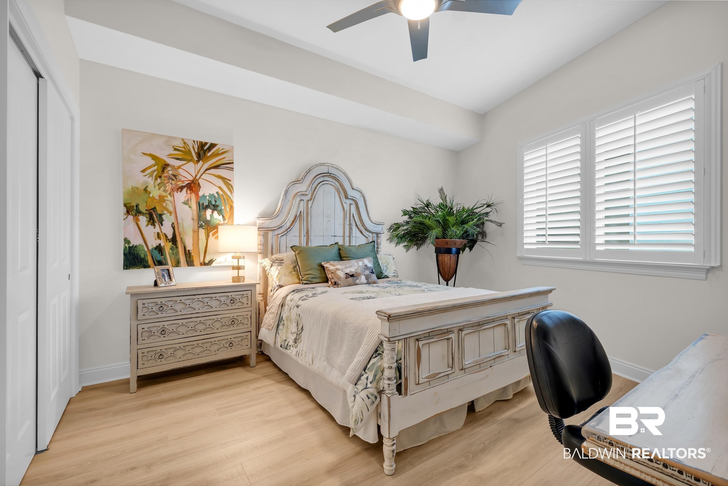 28250 Canal Road, Unit 307 Orange Beach, AL 36561 - Photo 39 of 56 Bedroom featuring wood finished floors, a closet, and a ceiling fan