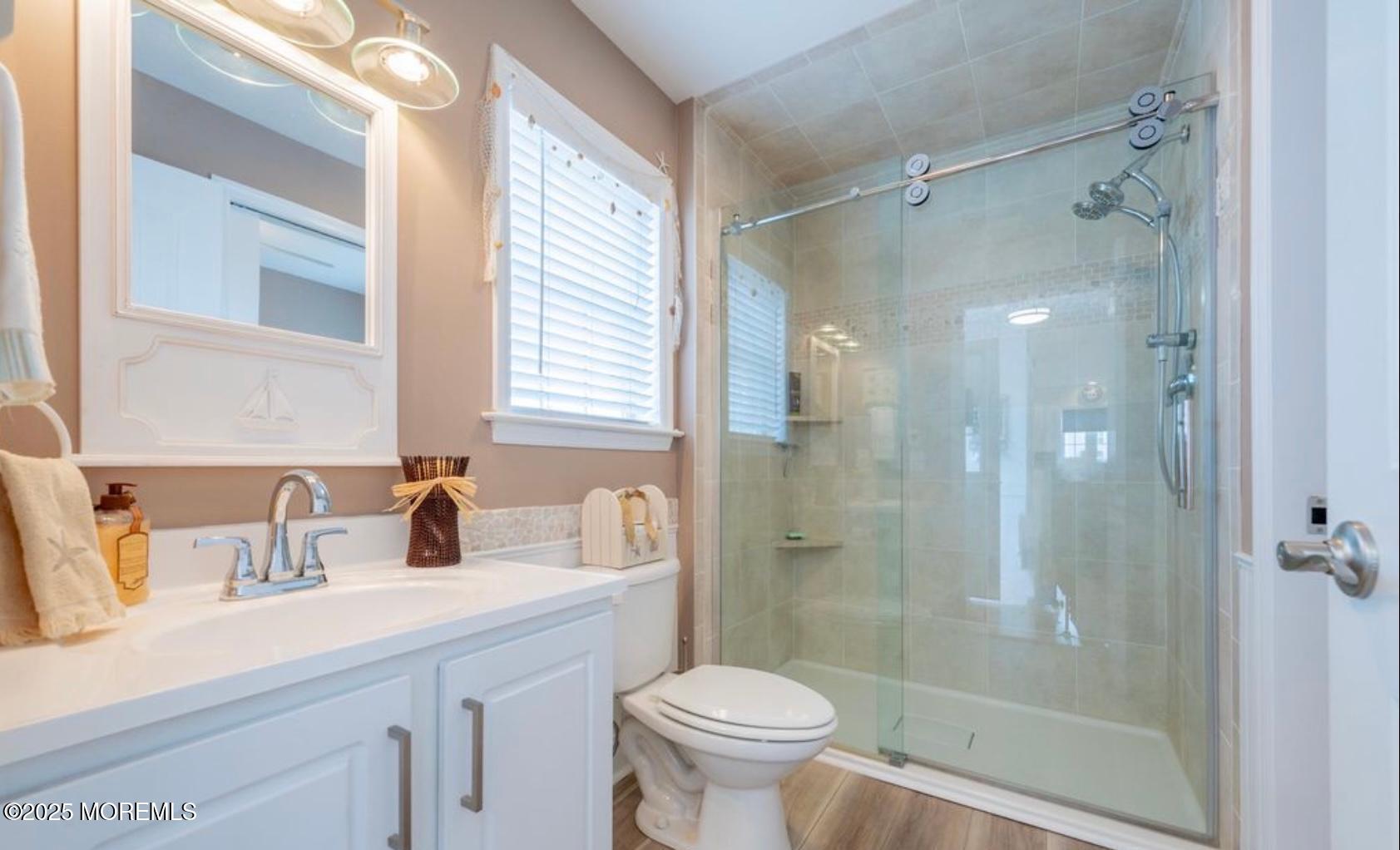 136 Joseph Street Lavallette, NJ 08735 - Photo 11 of 24 a bathroom with a sink toilet and shower