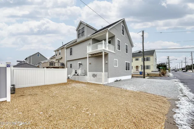 a view of a house with a snow in the yard