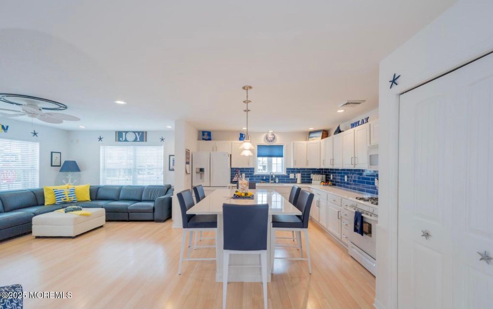 136 Joseph Street Lavallette, NJ 08735 - Photo 9 of 24 a living room with furniture and kitchen view