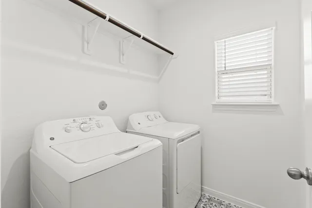 a utility room with dryer and washer