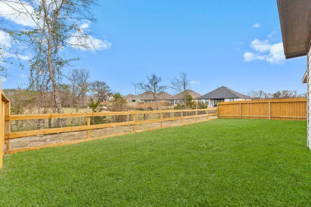 a view of swimming pool and an outdoor seating