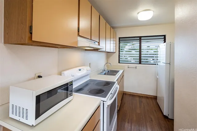 a utility room with sink dryer and washer
