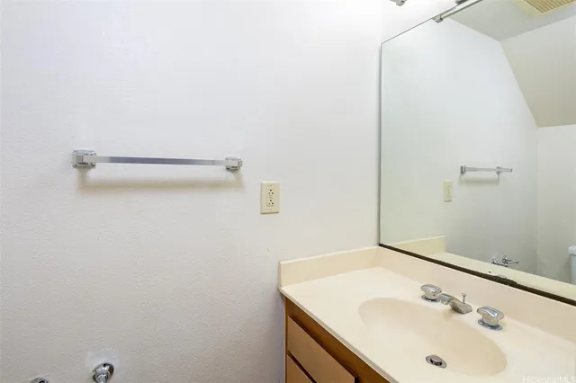 a bathroom with a sink and mirror