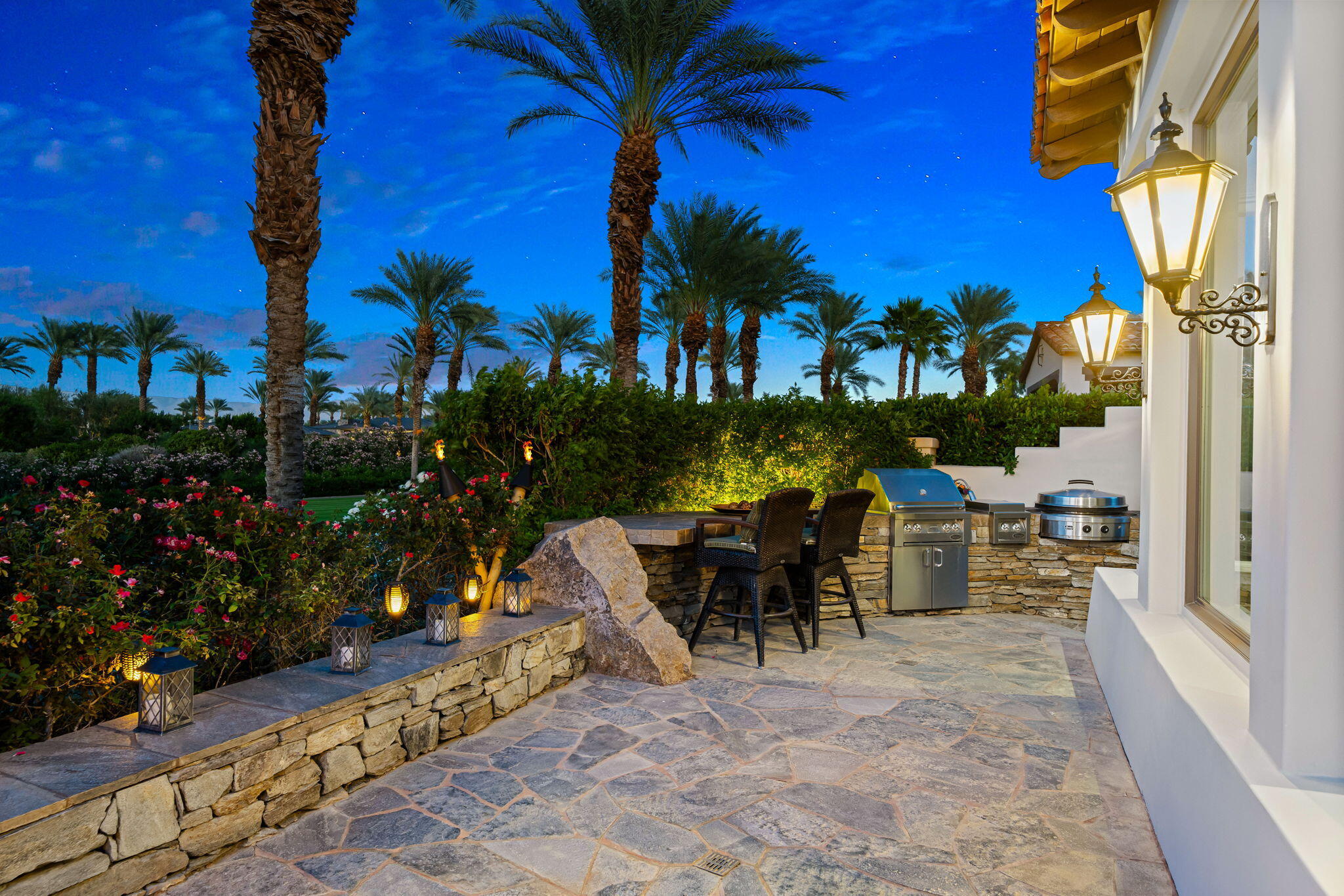 75836 Via Cortona Indian Wells, CA 92210 - Photo 103 of 113 a view of a patio with table and chairs and potted plants