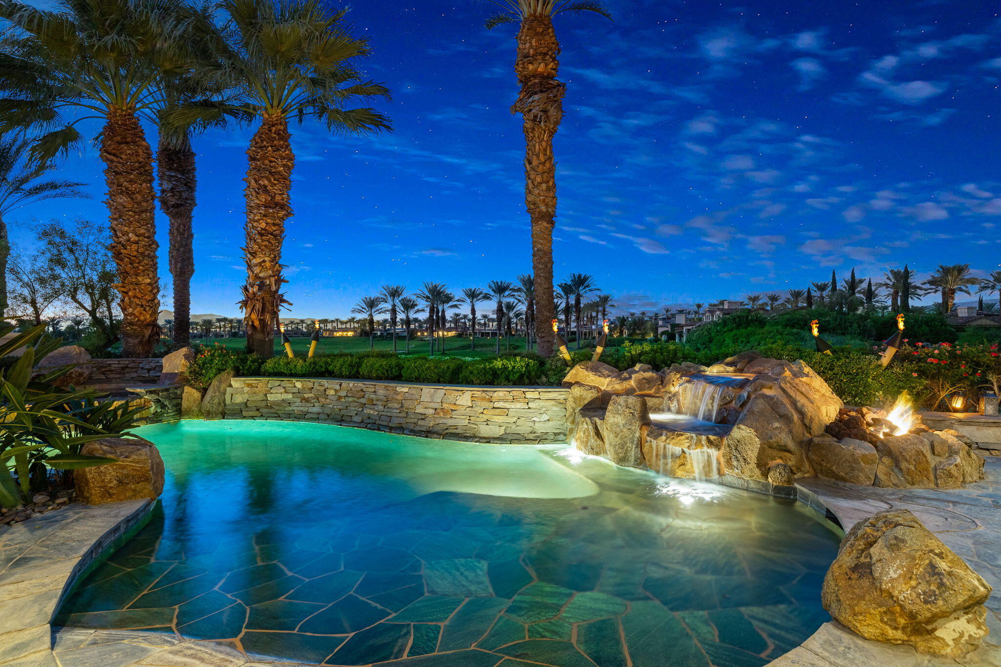 75836 Via Cortona Indian Wells, CA 92210 - Photo 107 of 113 a view of a lake with a building in the background