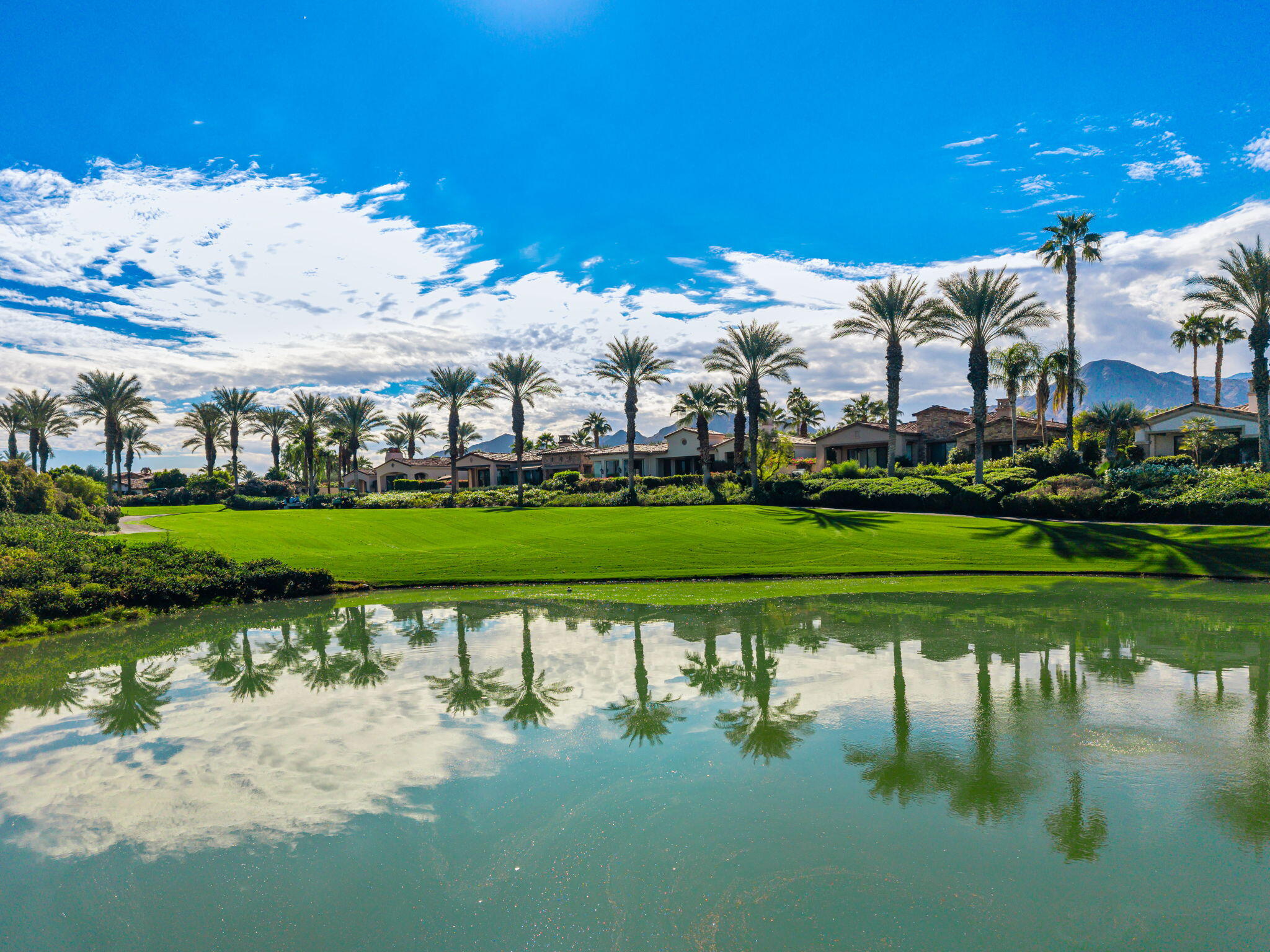 75836 Via Cortona Indian Wells, CA 92210 - Photo 14 of 113 a view of a golf course with a lake view