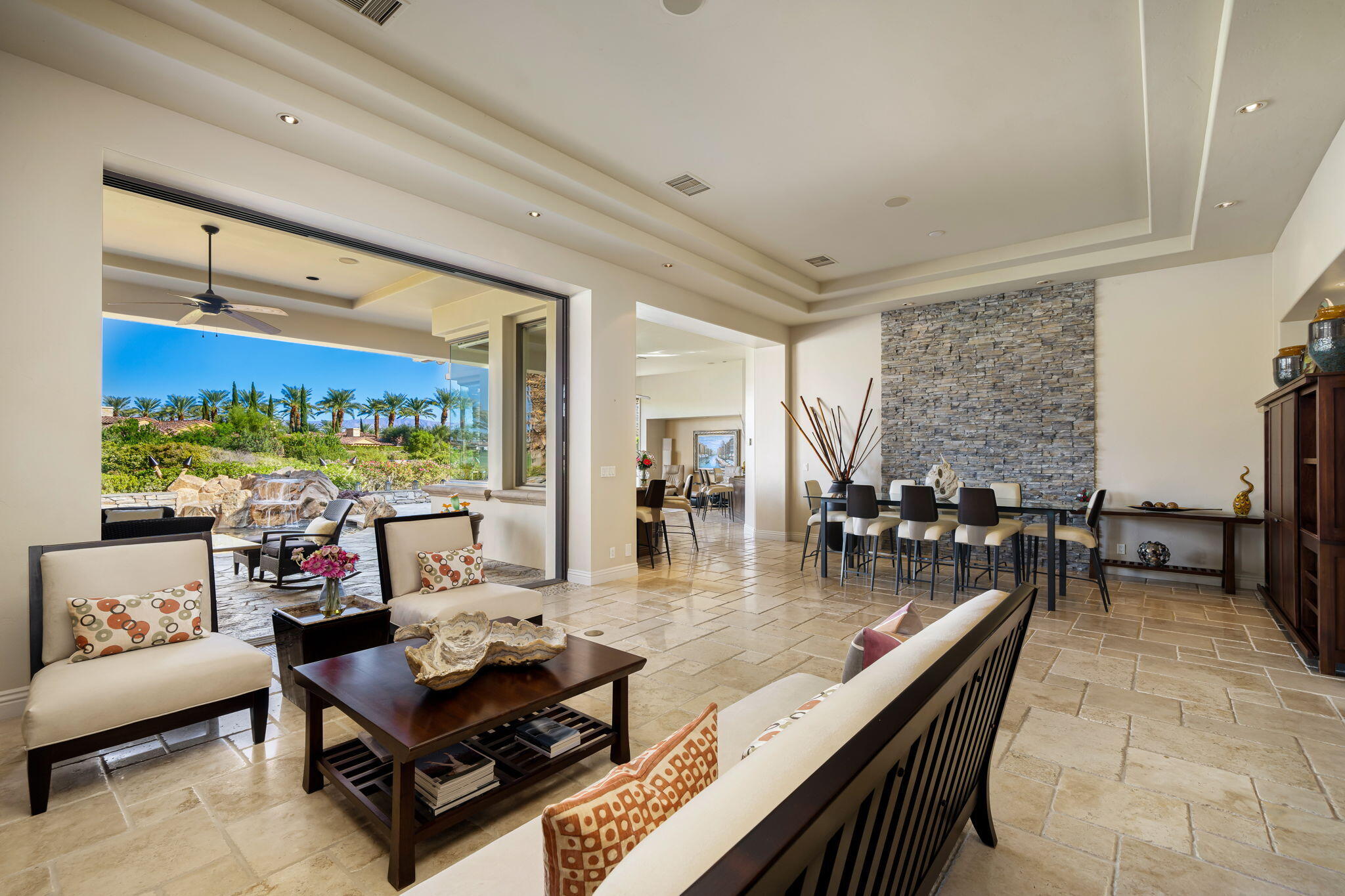 75836 Via Cortona Indian Wells, CA 92210 - Photo 27 of 113 a living room with furniture and a table