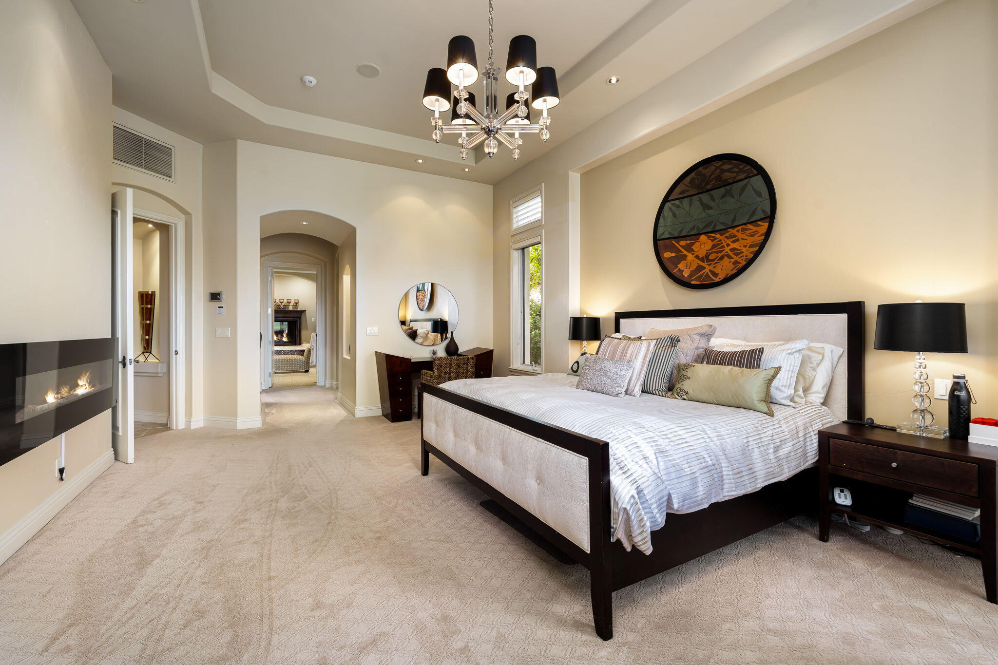 75836 Via Cortona Indian Wells, CA 92210 - Photo 59 of 113 a bedroom with bed and a chandelier