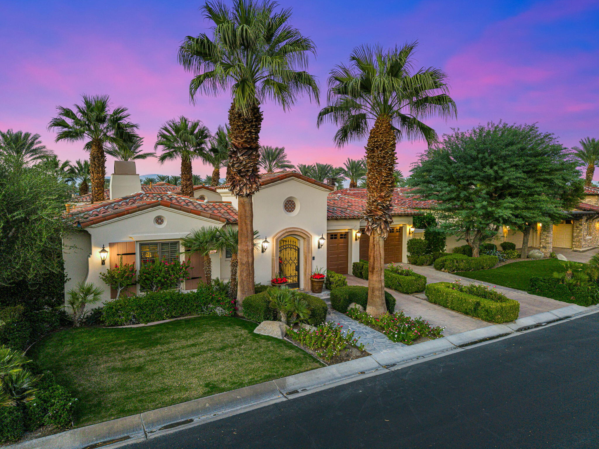 75836 Via Cortona Indian Wells, CA 92210 - Photo 78 of 113 a front view of a house with a garden