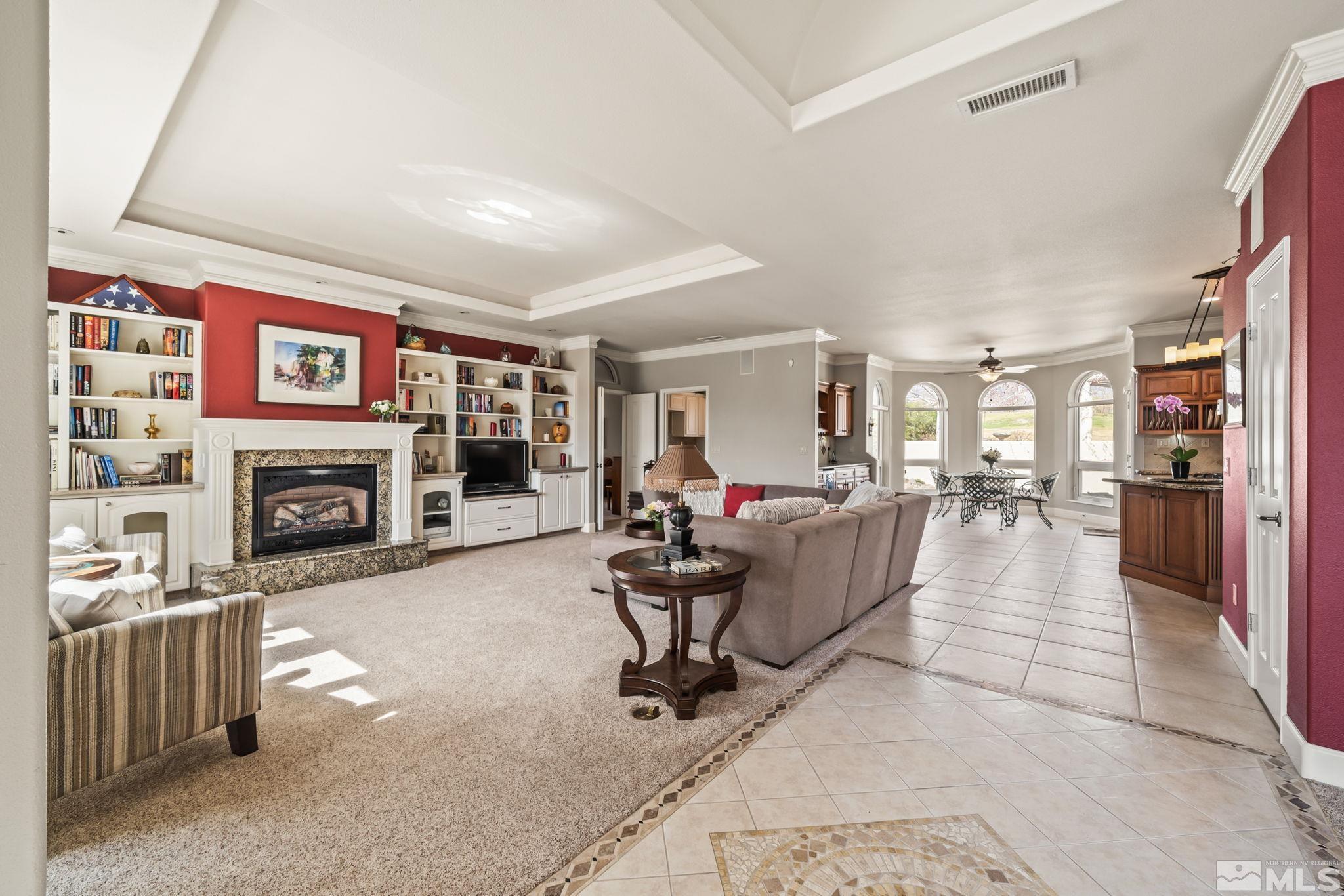 1335 Wolf Run Road Reno, NV 89511 - Photo 12 of 37 a living room with furniture and a fireplace