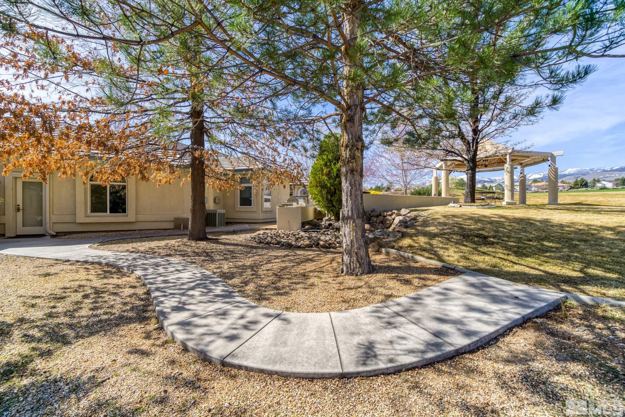1335 Wolf Run Road Reno, NV 89511 - Photo 2 of 37 a view of a yard with a tree