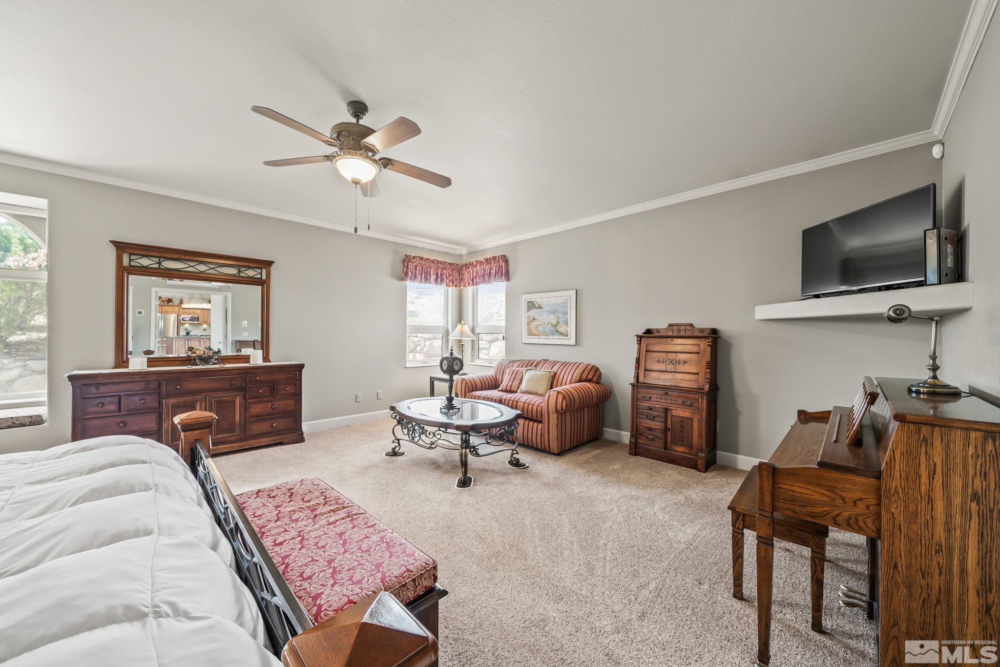 1335 Wolf Run Road Reno, NV 89511 - Photo 26 of 37 a living room with furniture or couch and a flat screen tv