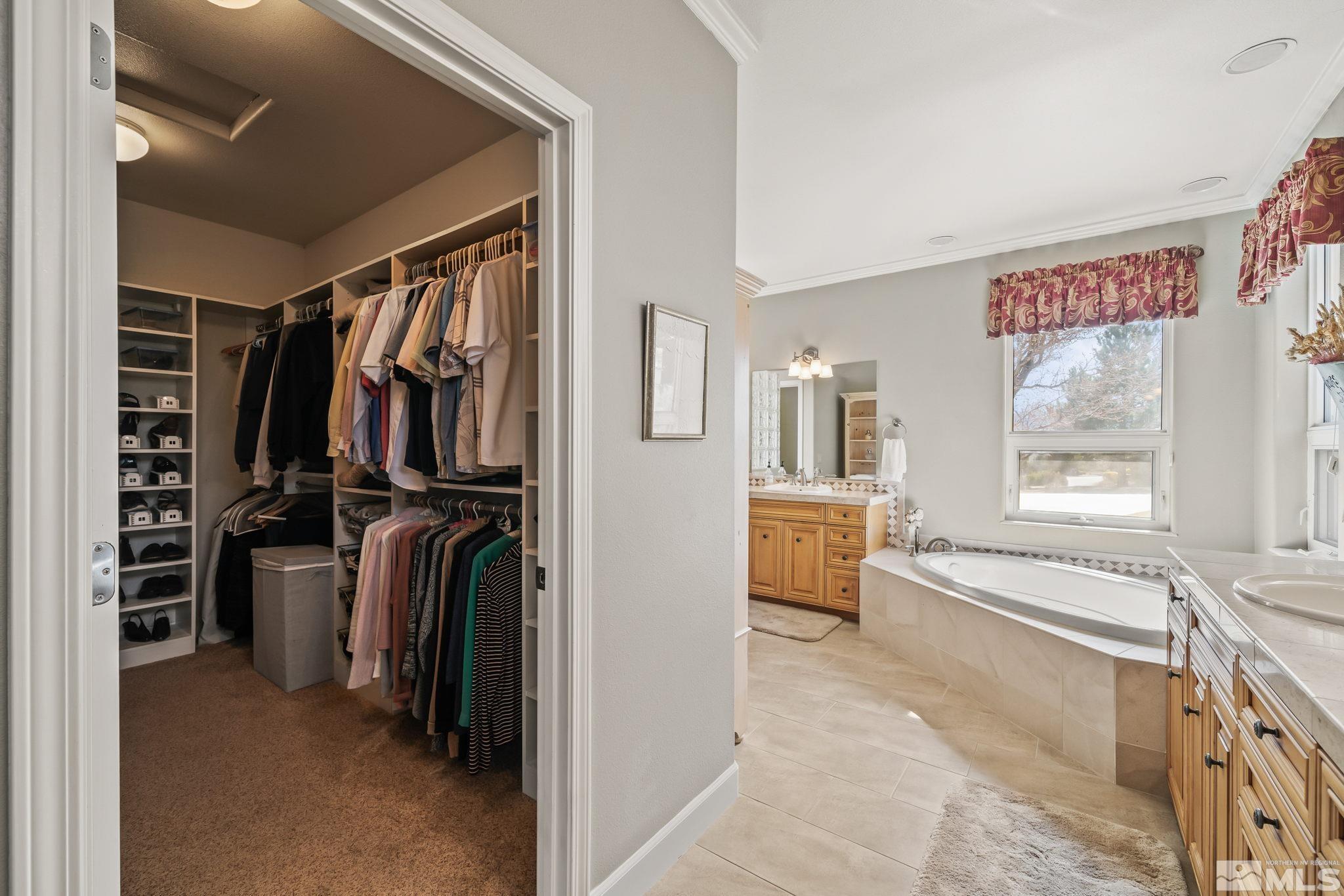 1335 Wolf Run Road Reno, NV 89511 - Photo 29 of 37 a view of walk in closet with clothes and shoes