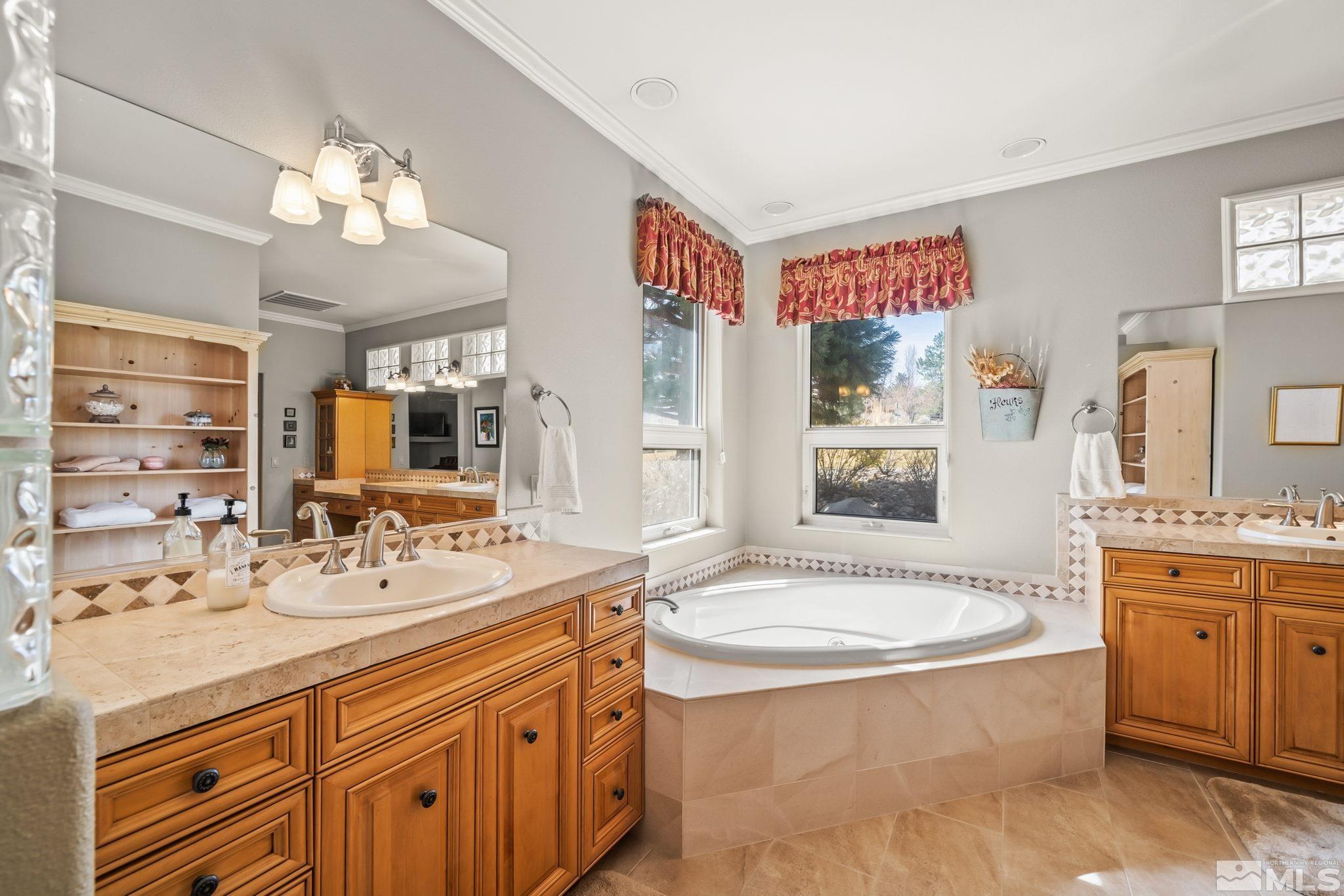 1335 Wolf Run Road Reno, NV 89511 - Photo 31 of 37 a spacious bathroom with a tub sink and mirror