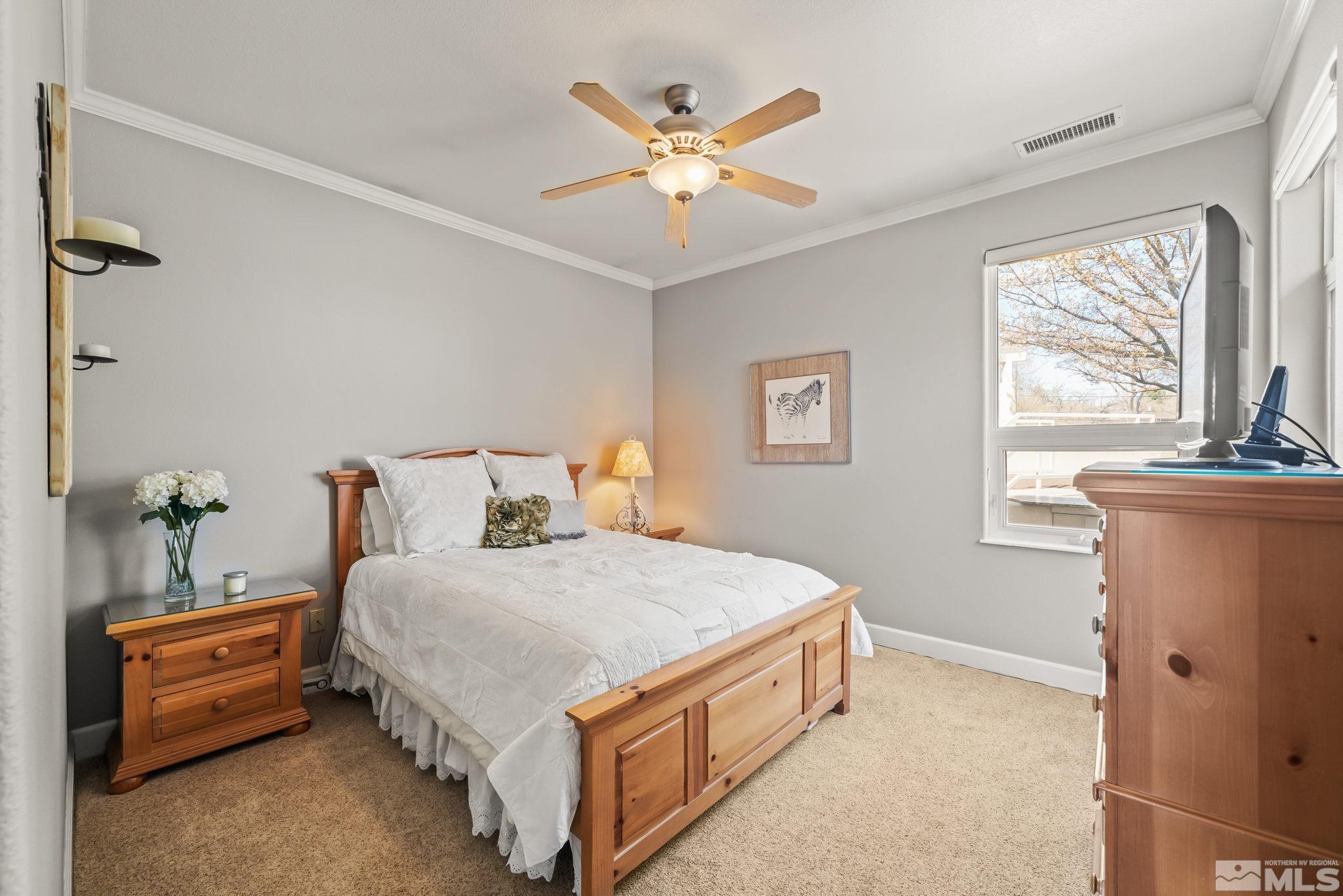 1335 Wolf Run Road Reno, NV 89511 - Photo 32 of 37 a bedroom with a bed and window