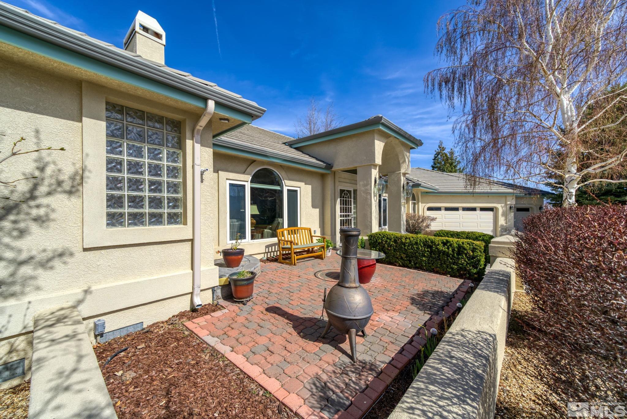 1335 Wolf Run Road Reno, NV 89511 - Photo 5 of 37 a front view of house with yard outdoor seating and barbeque oven