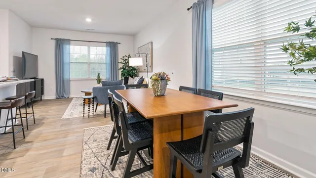 a view of a dining room with furniture and window
